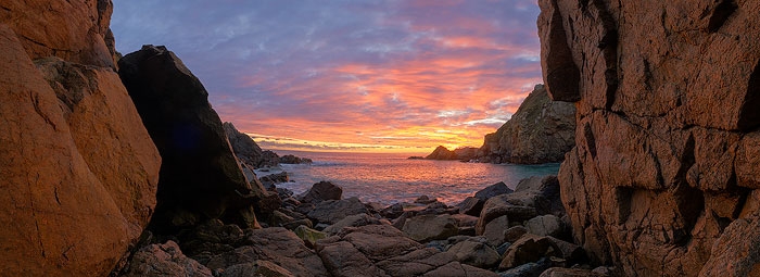 Panorama of a beautiful sunset at Le Jaonnet Bay on the south coast of Guernsey.