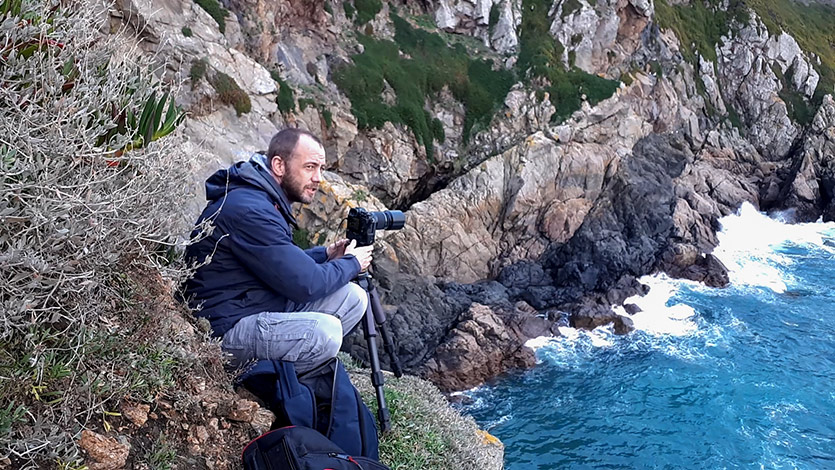 Scaling the Guernsey cliffs for winter photographs.