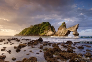 Island on Atuh Beach, Nusa Penida, Indonesia, at sunrise.