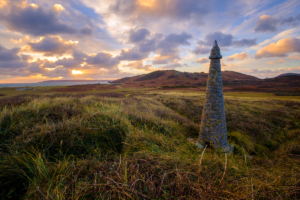 Pierre aux Rats obelisk on Herm common at sunrise.