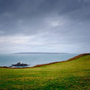 Storm clouds gathering over Sark, viewed from Herm.