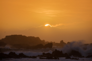 Sunset silhouette as Storm Freya whips up a rough sea.