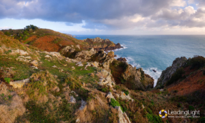 Looking east across cliffs toward Le Gouffre on Guernsey's south coast.