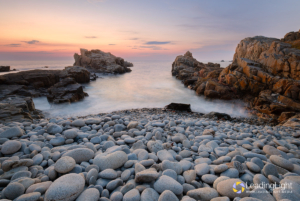 A small beach at L'Ancresse covered in beautifully rounded pebbles.