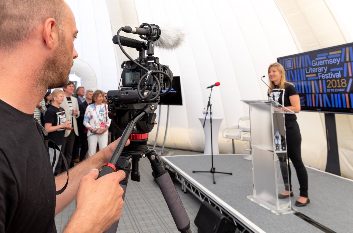 Videographer Dan Guerin filming at an event.