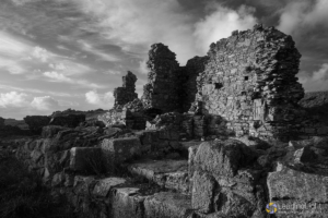 Ancient ruins of a priory on Lihou Island, Guernsey, in black and white.